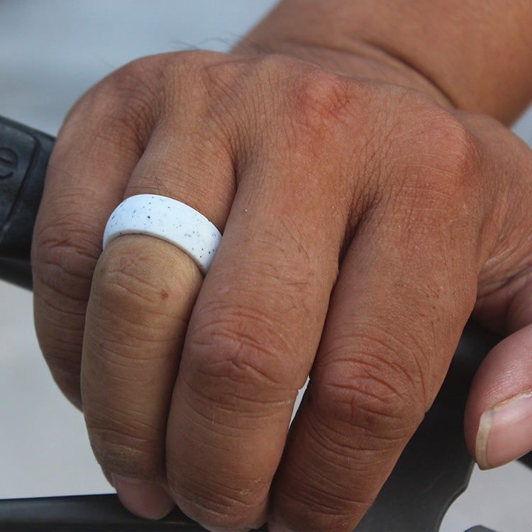 man wearing botthms white speckled silicone ring